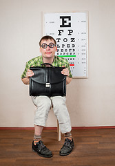 Image showing Funny manwearing spectacles in an office at the doctor