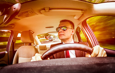 Image showing Man driving a car.