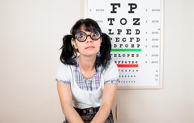 Image showing Funny woman wearing spectacles in an office at the doctor