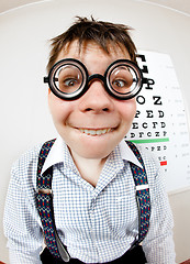 Image showing Funny boy wearing spectacles in an office at the doctor