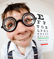 Image showing Funny boy wearing spectacles in an office at the doctor