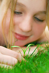 Image showing Girl and seedling