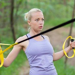 Image showing Training with fitness straps outdoors.