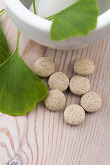 Image showing Ginkgo biloba leaves in mortar and pills