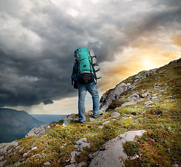 Image showing Backpacker in mountains