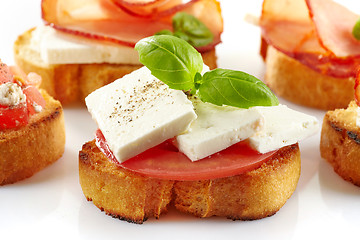 Image showing Toasted bread with fresh goat cheese and tomato