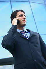 Image showing a businessman using mobile phone b