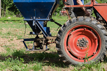 Image showing tractor wheel seeder equipment sow buckwheat seeds 