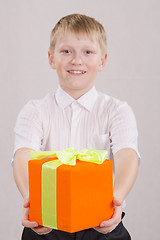 Image showing Boy gives gift