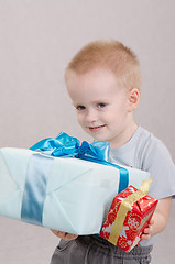 Image showing Little boy gave gifts