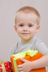 Image showing Happy year-old boy with a gift