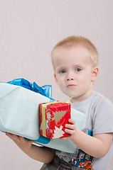 Image showing Year-old boy with two gifts