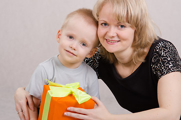 Image showing The boy and his mother with a gift