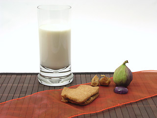 Image showing Selfmade christmas pastry with a glas of milk