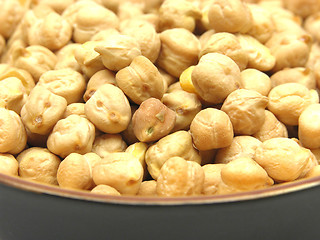 Image showing One bowl of ceramic with garbanzos on white
