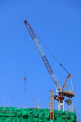 Image showing Construction crane on the roof top