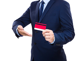 Image showing Businessman holding credit card