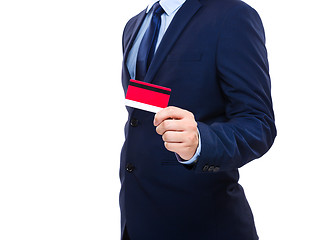 Image showing Businessman holding credit card