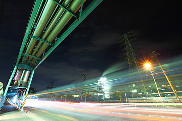 Image showing Industrial factory with traffic trail at night