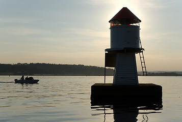 Image showing A boat and a lighthouse.