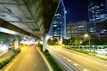 Image showing Car light trail and urban landscape