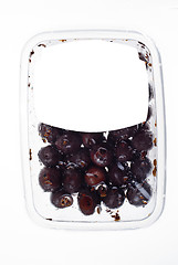 Image showing olives in plastic box surface