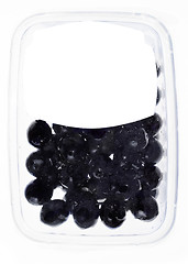 Image showing olives in plastic box surface