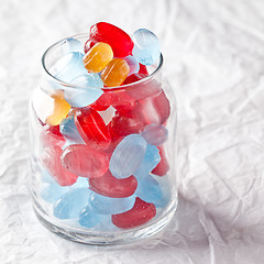 Image showing colorful candies in glass jar 
