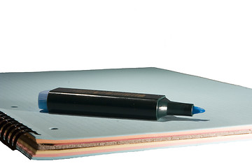 Image showing blue marker on blue notepad