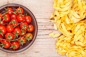 Image showing uncooked pasta and fresh tomatoes