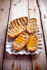 Image showing crackers with honey in plate