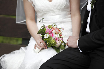 Image showing Hands of a bride and groom