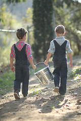 Image showing Kids Working on the Farm  With a Pail