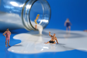 Image showing Plastic People Swimming in Milk