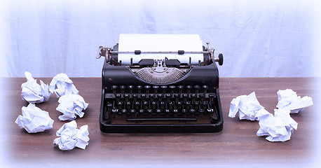 Image showing Vintage typewriter and old books