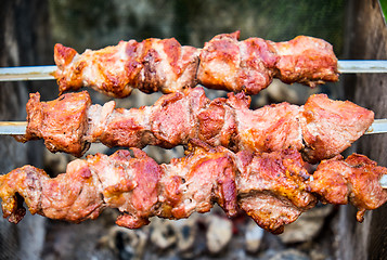 Image showing Hot shish kebab on metal skewers