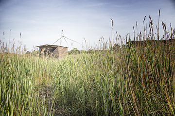 Image showing Fishing shack on sea channel