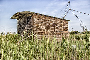 Image showing Fishing shack on sea channel