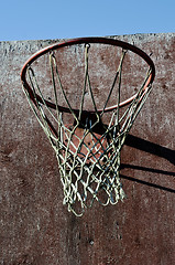 Image showing closeup of old basketball backboard and hoop outdoor