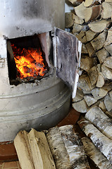 Image showing old stove flame and birch firewood