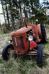 Image showing old rusty tractor in the forest