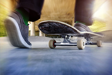 Image showing Boy on a used skateboard