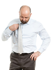 Image showing business man selects tie