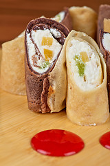 Image showing pancake roll with marmalade