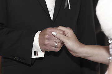 Image showing Hands of a bride and groom