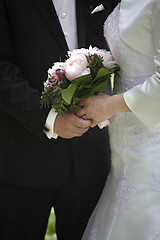 Image showing Hands of a bride and groom