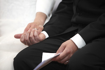 Image showing Hands of a bride and groom