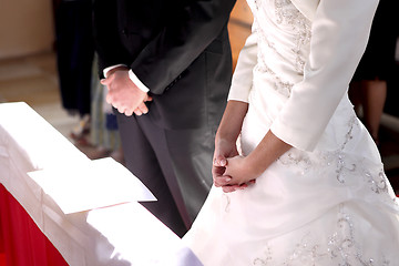 Image showing Hands of a bride and groom