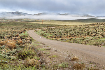 Image showing dirt road in a mountain valley