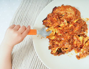 Image showing Child and lasagna